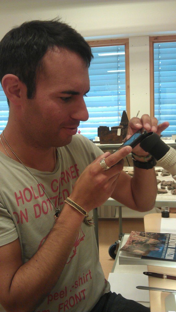 Patrik photographing through a microscope