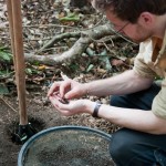 Kjell examining some soil for possible archaeological material.